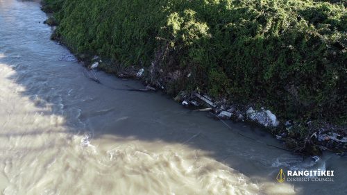 Image 2 - View of river edge, noting concrete and other debris.