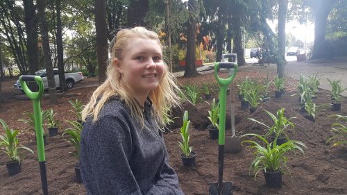 Charly Ward-Berry alongside plantings at Marton Memorial Park - TRYB's first project which remembered the tragic Christchurch mosque shootings