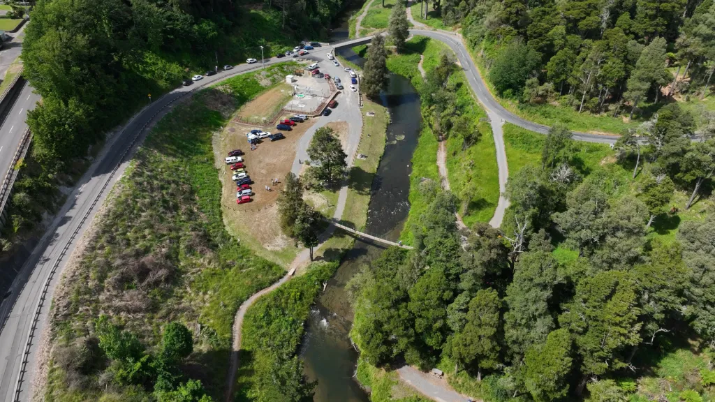 A overhead, bird's eye view of Papakai Park following the completion of the wastewater upgrades, and a completed swing bridge across the Hautapu River.